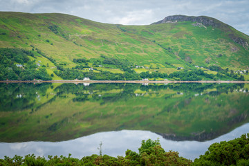 Mirror like reflections over Loch Broom in a cloudy morning