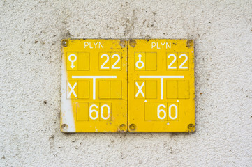 Yellow table on the wall. Czech text Plyn (Gas) is on the sign. Sheet describes and locate piping and network for distribution of gas from gasworks to consumer