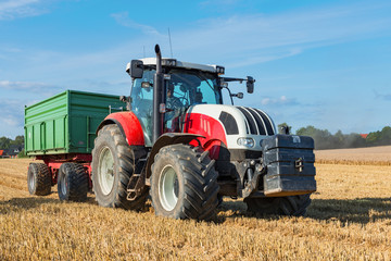 Tractor with trailer at the grain harvest in the field - 6643 © Wolfgang Jargstorff