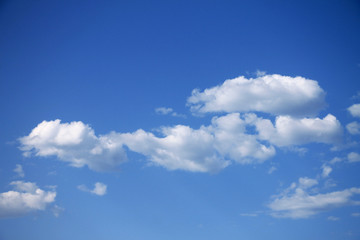 Naklejka na ściany i meble Summer blue sky with small white clouds