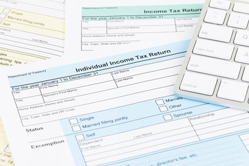 Tax form with keyboard; document are mock-up