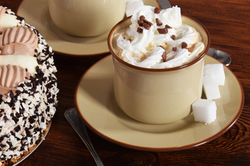 coffee with whipped cream and chocolate and coffee with cream cake