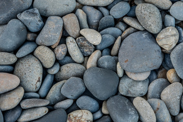 Fototapeta na wymiar Wide view of smooth beach rocks
