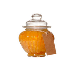 A jar with orange jam on a white background. Isolated.