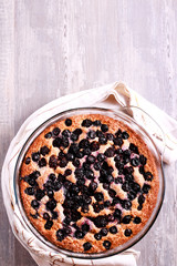 Obraz na płótnie Canvas Buttermilk wholewheat cake with berries in a tin