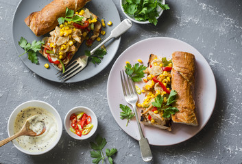 Fajita sandwich. Chicken fajitas spicy grilled baguette on a gray background, top view. Flat lay