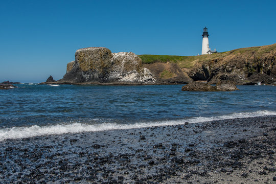 Yaquina Head Lighthouse from rocky beach