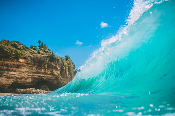 Blue ocean wave at tropical sand beach. Clear wave in tropics