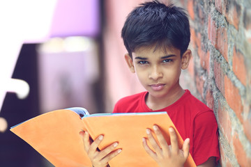 Fototapeta premium Indian Little Boy with Textbook