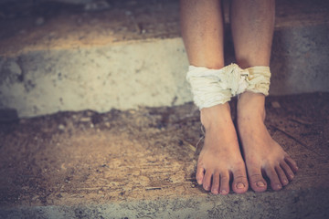 Woman bondage in angle of abandoned building image blur , stop violence against Women, international women's day