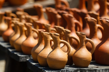 Fototapeta na wymiar Traditional Georgian clay jugs for sale in the village