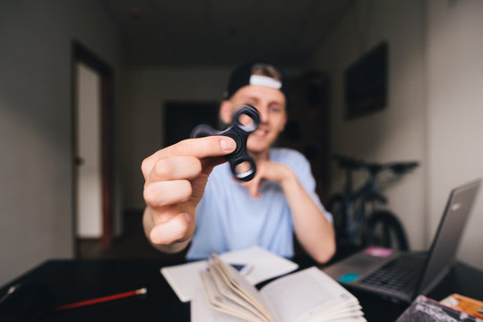 The baby is playing Fidget Spinner. Focus on the spiner