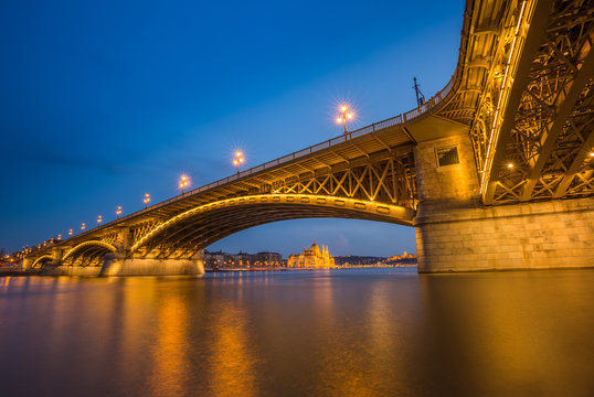 Budapest, Hungary - Blue hour at the beautiful illuminated Margaret Bridge with the Parliament of Hungary, Szechenyi Chain Bridge and Buda Castle at background