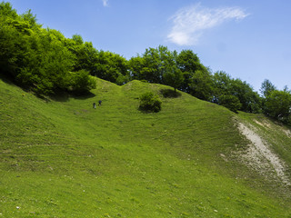 Two young men climb up