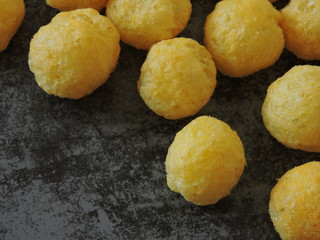 Corn balls on a gray background. Macro. Copy space.