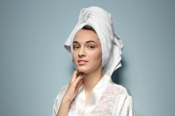 Obraz premium Beautiful young woman after shower on light background