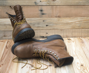 A pair of well worn Work Boots.