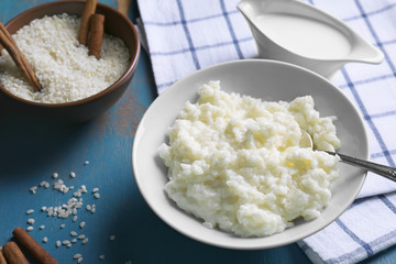 Delicious rice pudding in bowl on kitchen table