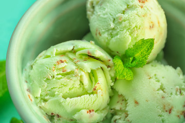 Bowl with delicious mint chocolate chip ice cream, closeup