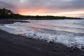 Sunrise on black sand beach, Hawaii