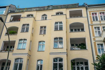 yellow building with big balconies