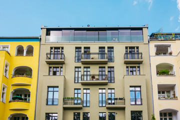 yellow, grey and brown buildings in a row at german street