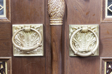 two gold plated rings on the outer doors of the Naval Cathedral of St. Nicholas, Kronstadt.