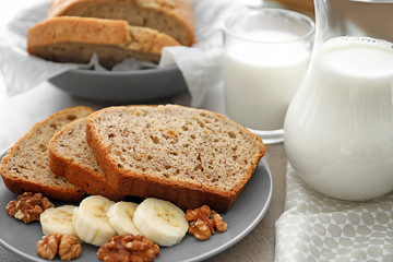 Sliced banana bread with nuts on plate