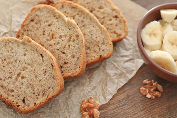 Sliced banana bread with nuts on table