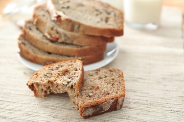 Sliced banana bread with nuts on plate