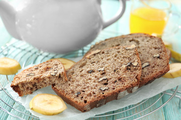 Sliced banana bread with nuts on table