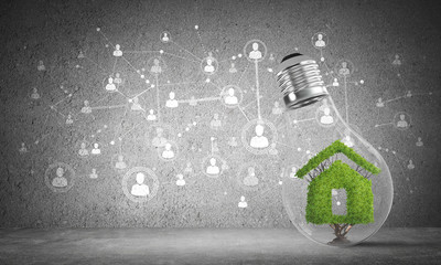 House symbol inside glass lightbulb.