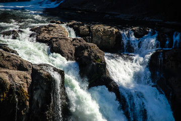 Waterfall through large rocks