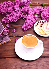 Obraz na płótnie Canvas Espresso coffee in a white cup with a saucer