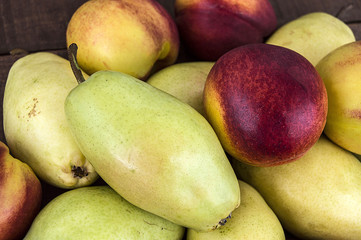 Summer fruit in a fruit basket, pear, apple and nectarine...
web design according pears and nectarines photos

