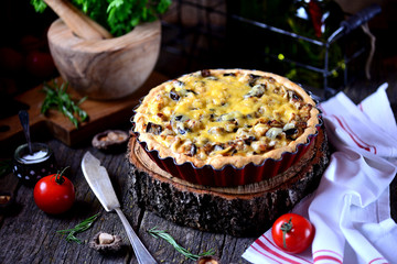 Delicious pie with chicken meat, eggplant, mushrooms, onion and cheese.