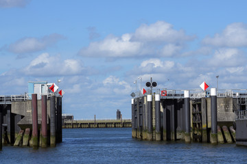 Entrance into the north sea port of cuxhaven in germany with iron gates, which can be closed at...