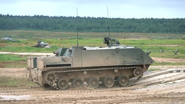Slow motion shot of moving Russian armored personnel carrier