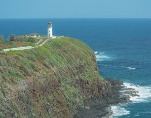 Fototapeta na wymiar Far of shot of the Kilauea Lighthouse, the ocean and a shear cliff, on Kauai, Hawaii