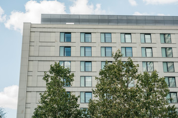 office building with green trees