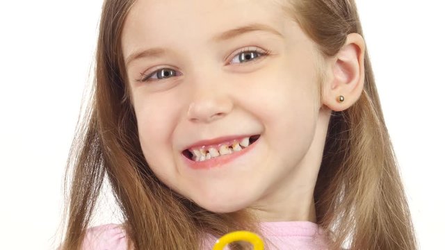 Child lets the soap bubbles. White background. Close up
