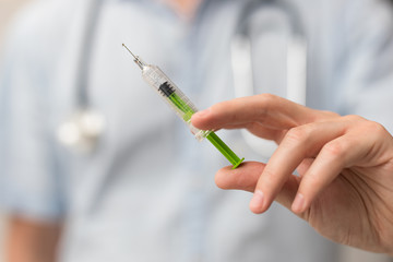 Syringe, medical injection in hand. Vaccination equipment.