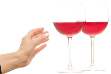 Female hand holding two glasses of red wine