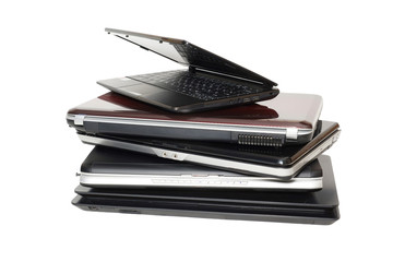 Old Laptops. A stack of old laptops on a white background. Five pieces. Isolated.