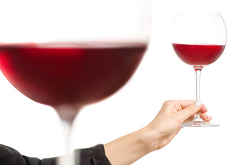 Glasses of red wine in two hands