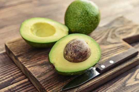 Fresh avocado on cutting board