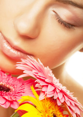 woman with gerber flower isolated on white background 