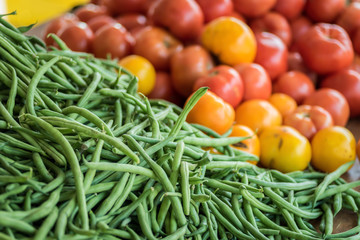 fresh green beans and tomatoes at farmers market