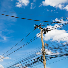 The electric pole and electric transformer with clear blue sky 