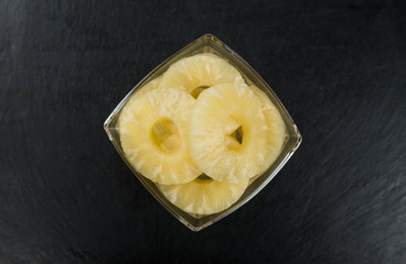 Rustic slate slab with Preserved Pineapple Rings, selective focus